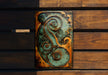 a metal art piece sitting on top of a wooden bench