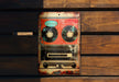 an old radio sitting on top of a wooden bench
