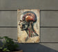 a painting of a human head on a wall