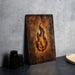 a picture of a fire on a wooden plaque