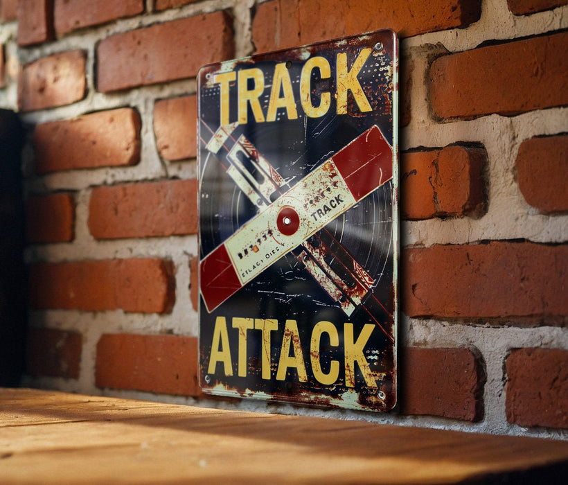 a sign on a brick wall that says track attack