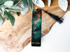 a bookmark with a picture of a person on it