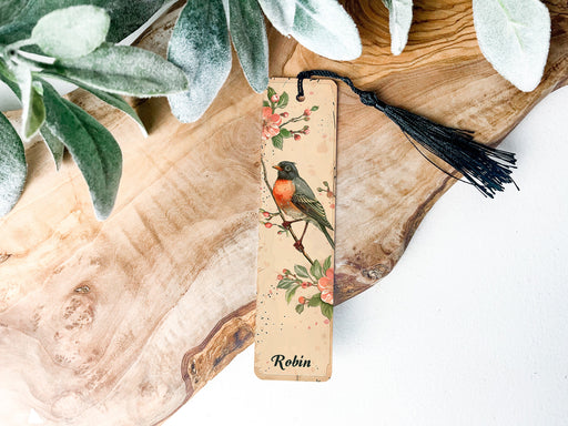 a wooden bookmark with a bird on it
