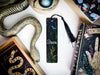 a snake, bookmark, and other items on a table
