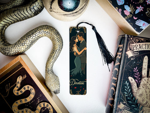 a bookmark with a picture of a woman and a snake on it