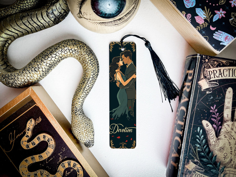 a bookmark with a picture of a woman and a snake on it