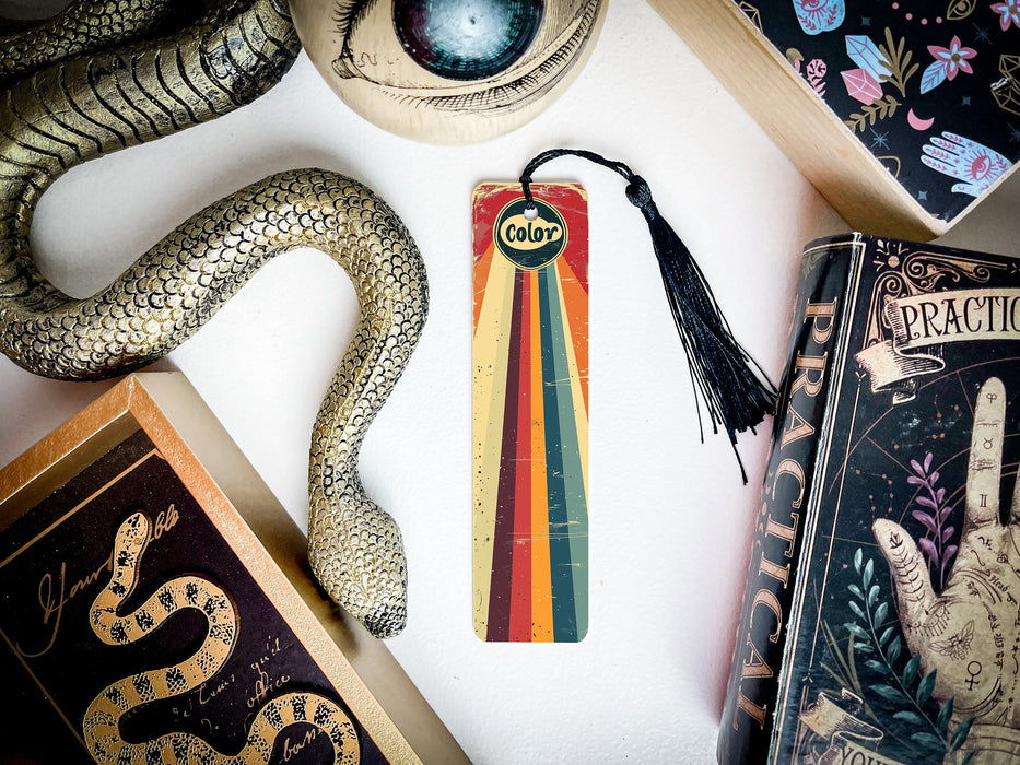 a snake, a bookmark, and other items are on a table