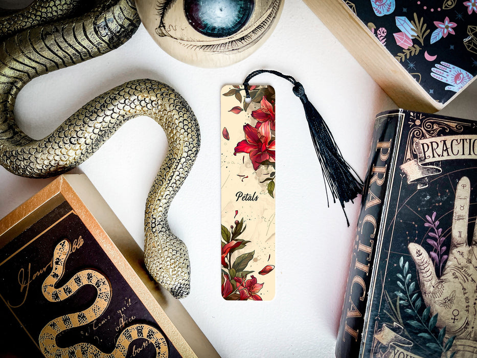 a bookmark with a snake on it next to other books