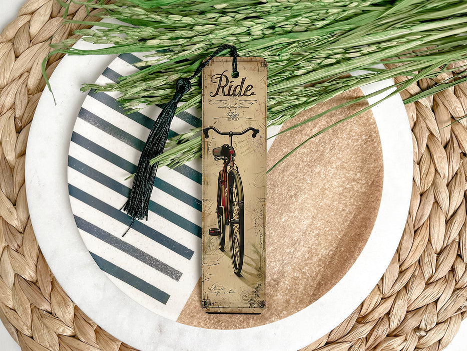 a bookmark with a bike on it sitting on a plate