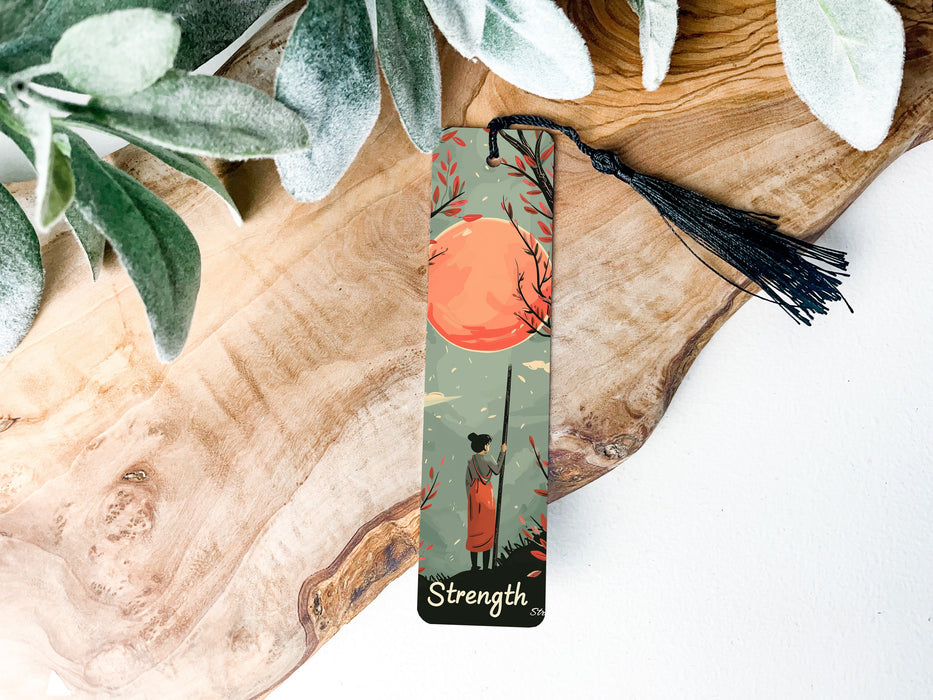 a bookmark with a picture of a tree and a sunset