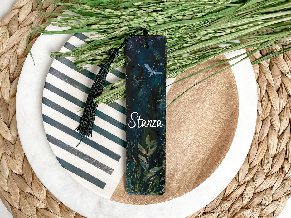 a green bookmark sitting on top of a white plate