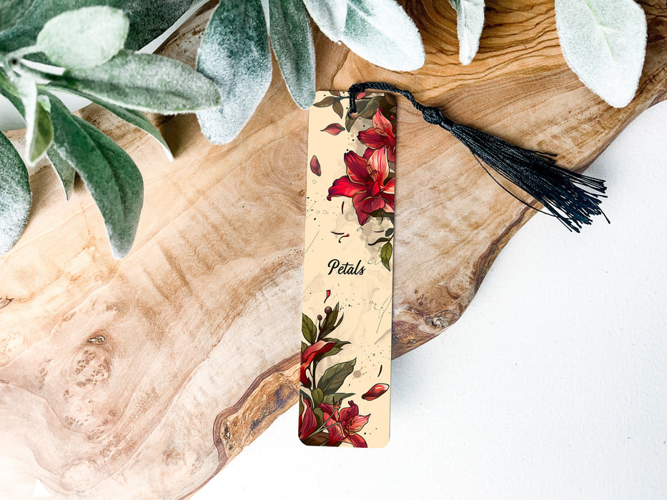 a bookmark with a floral design and a tassel