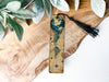 a wooden ruler with a tassel on top of it