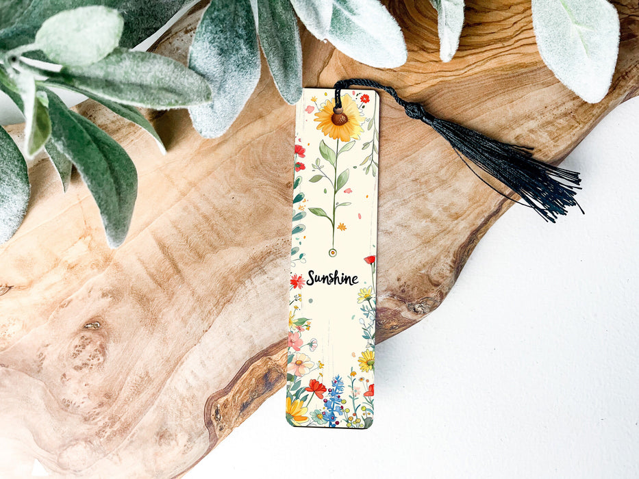 a bookmark with a tassel hanging from it
