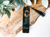 a bookmark with a picture of a couple kissing