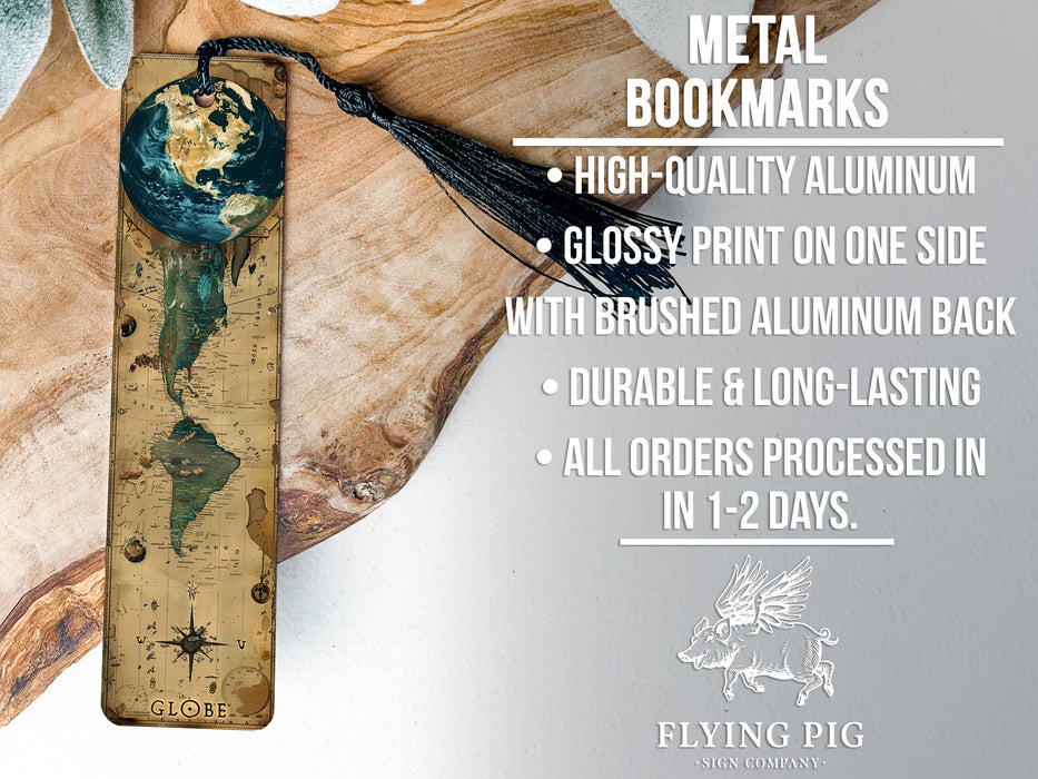a metal bookmark with a tassel hanging from it