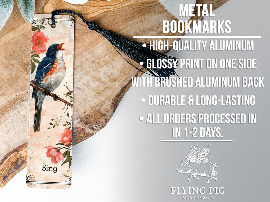 a metal bookmark with a bird on it
