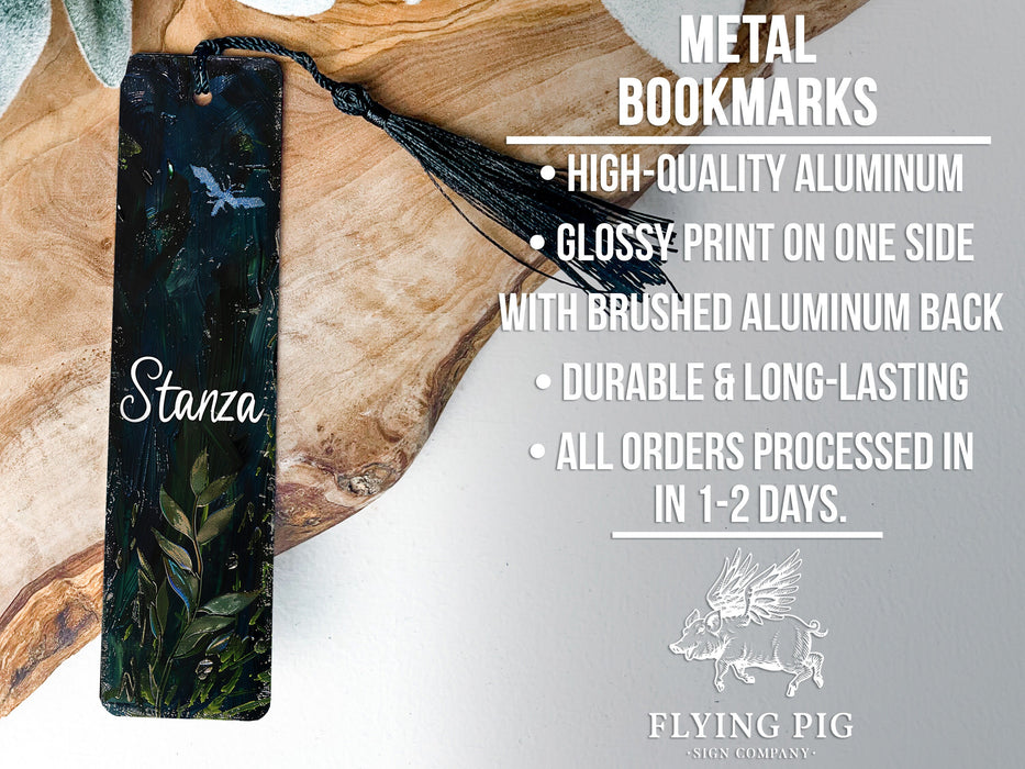 a metal bookmark with a tassel hanging from it