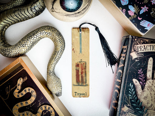 a collection of books and a snake on a table