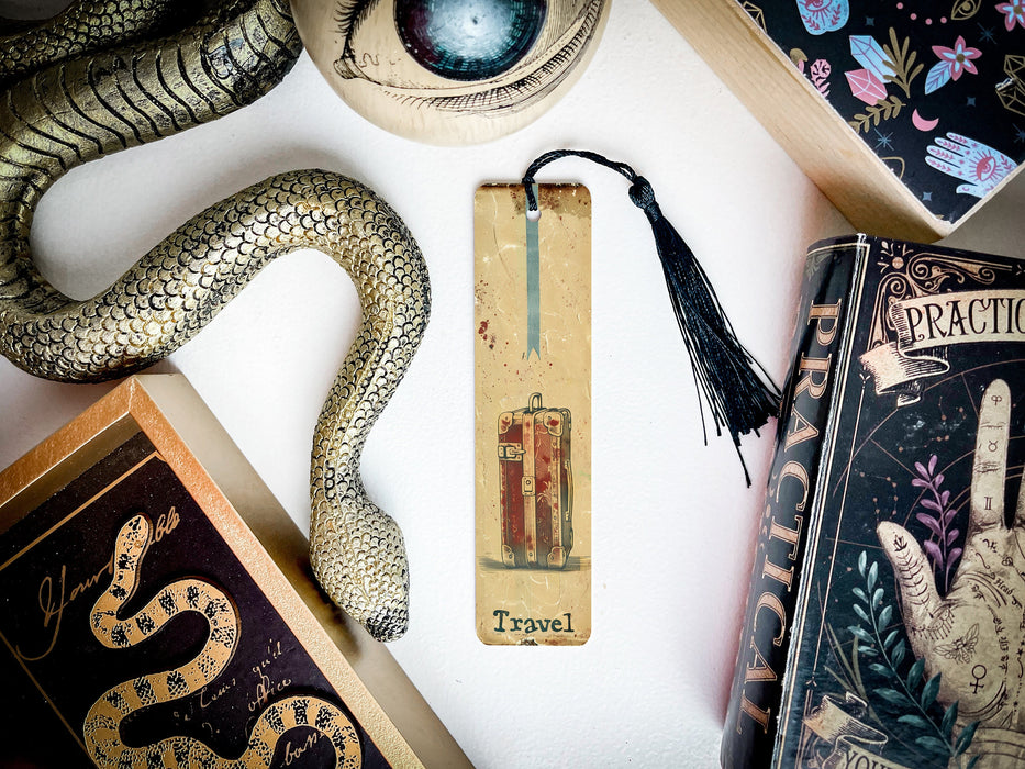 a collection of books and a snake on a table