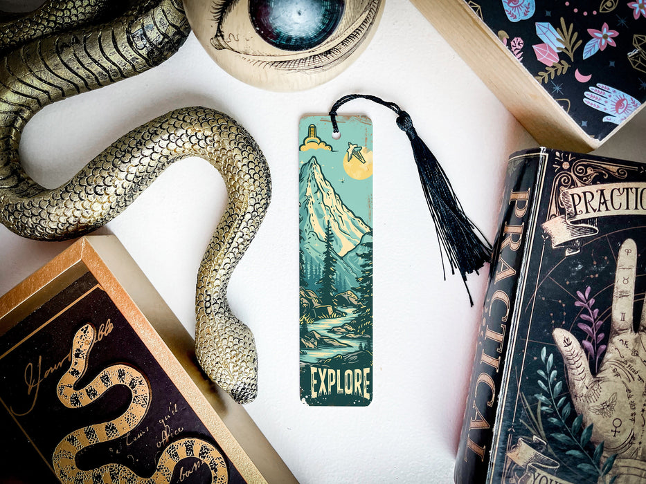 a bookmark with a snake on it next to other books