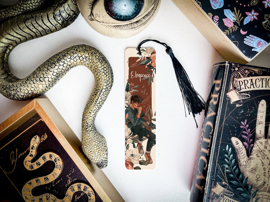 a snake, bookmark, and other items on a table