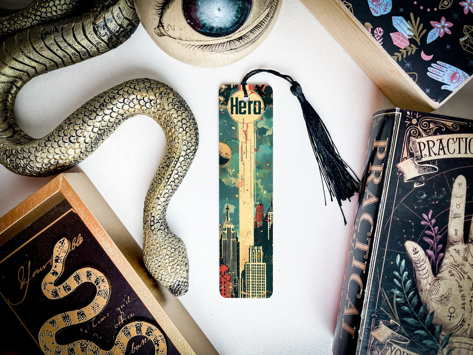 a bookmark with a snake on it next to other books