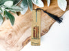 a piece of wood with a tassel on top of it