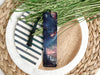 a bookmark sitting on top of a white plate