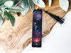 a bookmark with a picture of planets on it