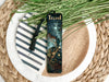a bookmark with a train on it sitting on a plate