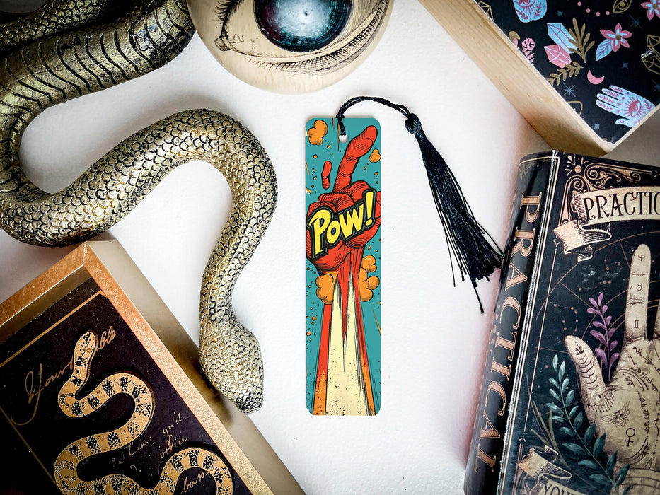 a bookmark with the word powi on it next to a snake