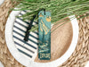 a bookmark with a picture of a mountain on it