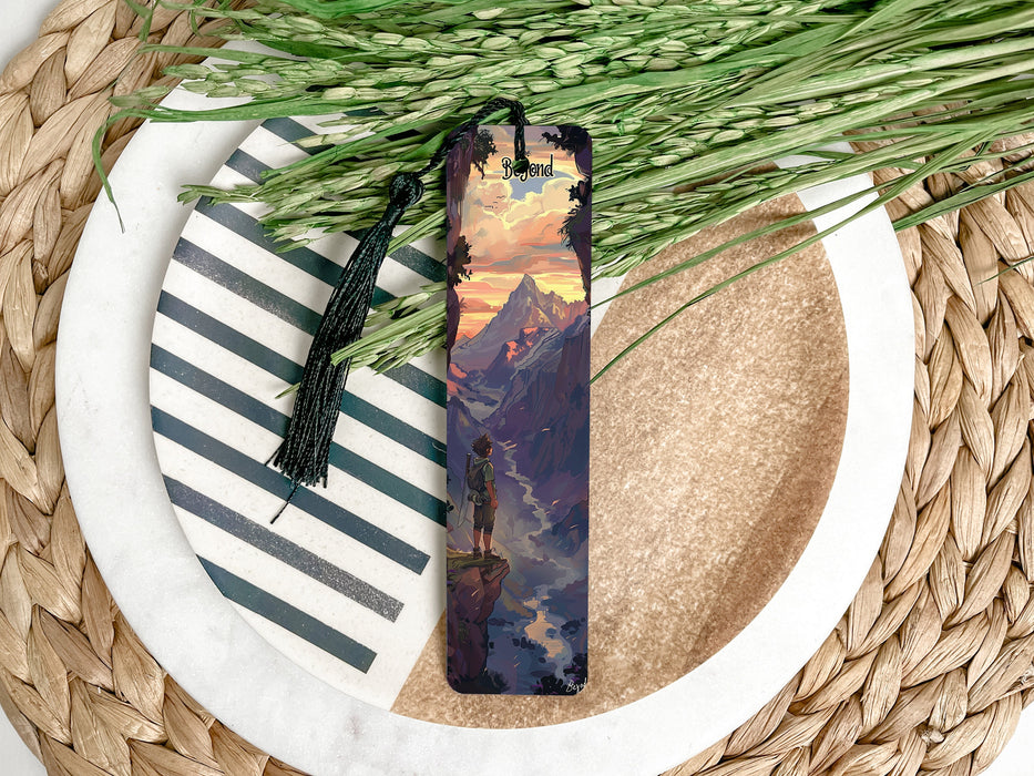a bookmark with a painting of a mountain scene on it