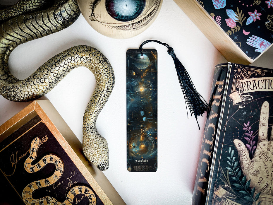 a bookmark, snake, and other items on a table