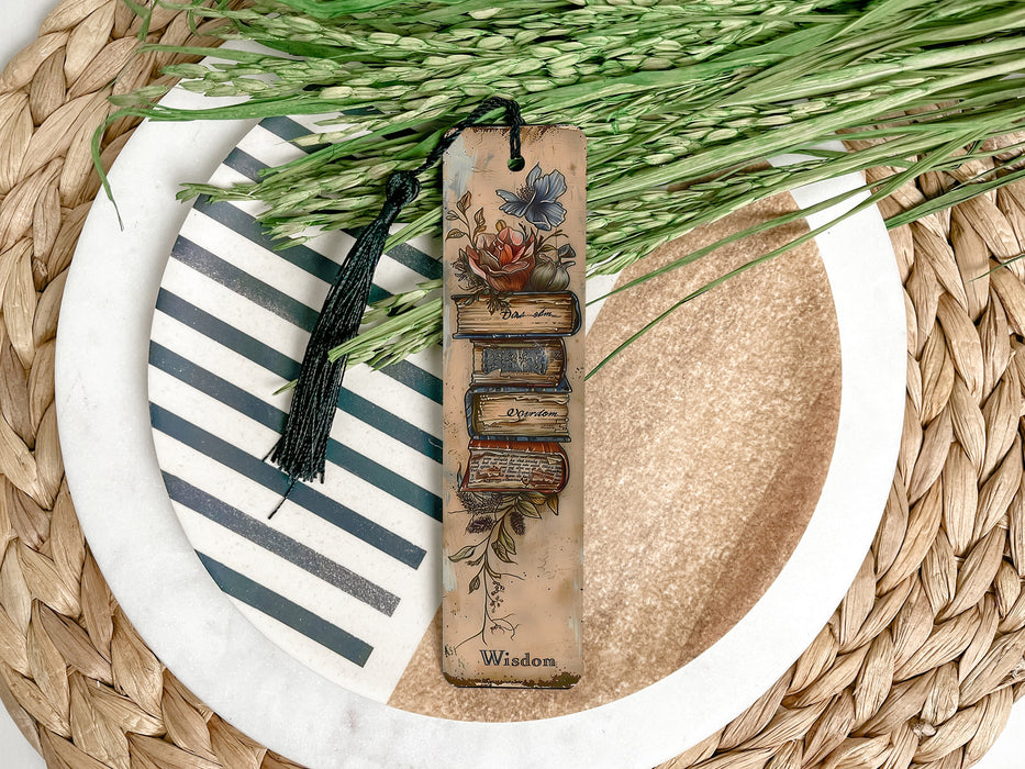 a bookmark on a plate next to a bunch of grass