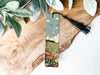 a bookmark with a picture of a field of flowers