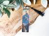 a bookmark with a picture of a mountain on it