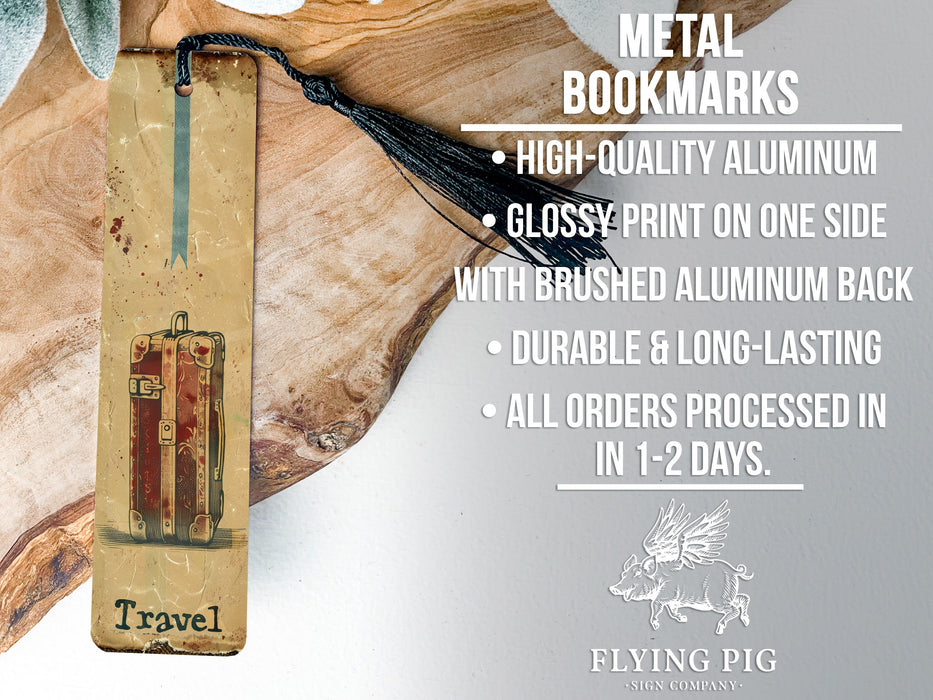 a metal bookmark with a tassel hanging from it