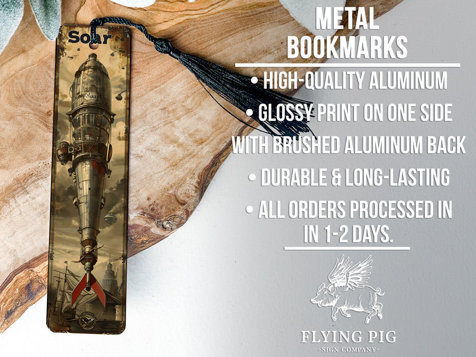 a metal bookmark with a picture of a rocket ship on it
