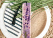 a purple bookmark with lavender flowers on it