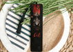 a bookmark with a picture of a demon on it