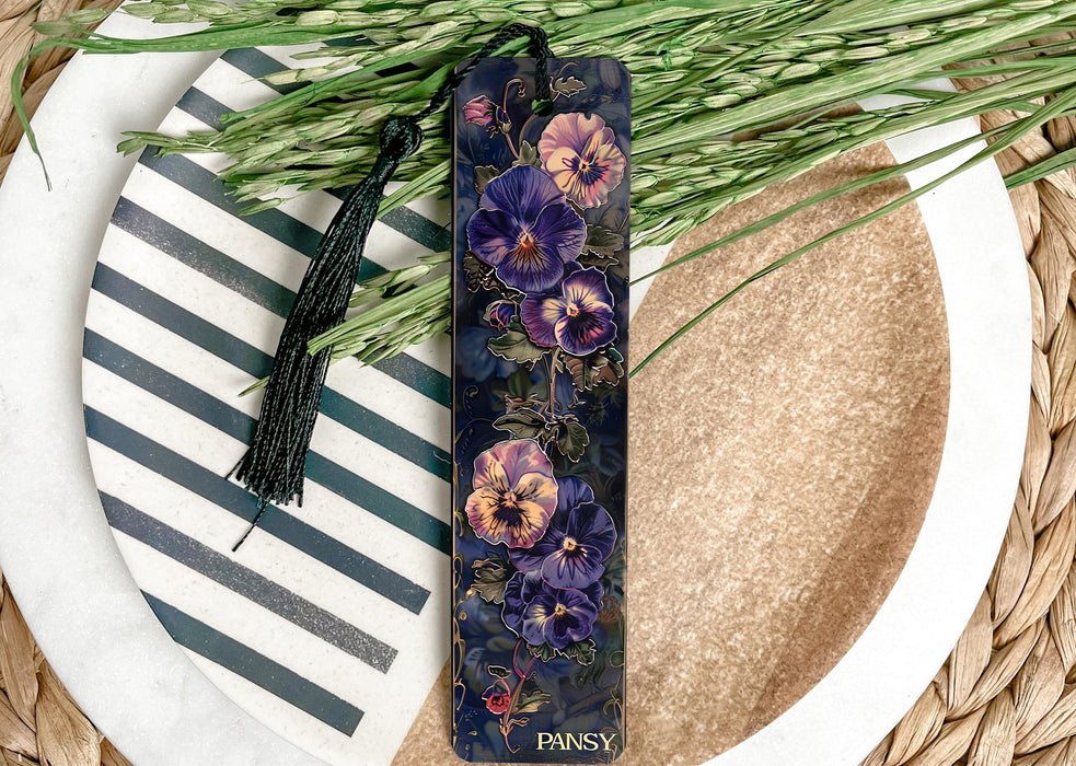 a purple flower bookmark sitting on top of a plate