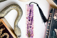 a bookmark, snake, and other items on a table