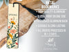a metal bookmark with a floral design on it