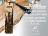 a metal bookmark with a tassel on top of it
