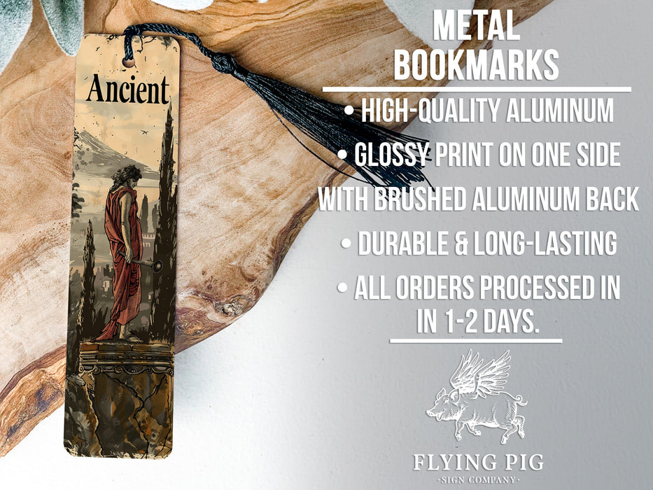 a metal bookmark with a tassel on top of it
