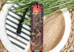 a bookmark with a picture of a dragon on it
