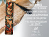 a close up of a bookmark on a piece of wood