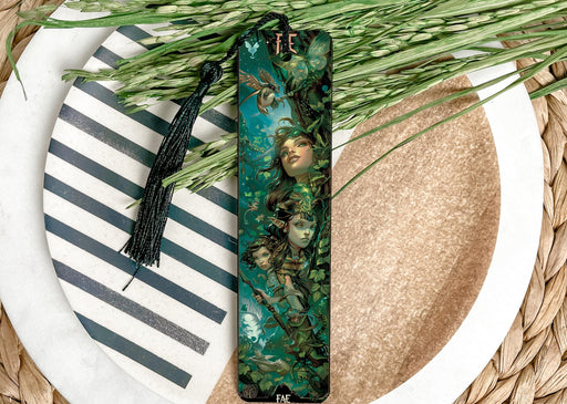 a green bookmark sitting on top of a white plate